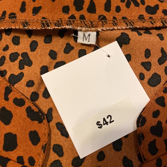 Boutique:Cheetah print brown with black spots, Bell sleeve dress never worn - Picture 11 of 11